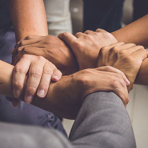 People with hands together