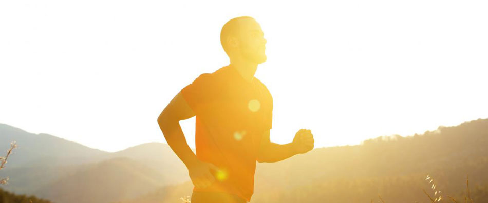 Man jogging at sunset